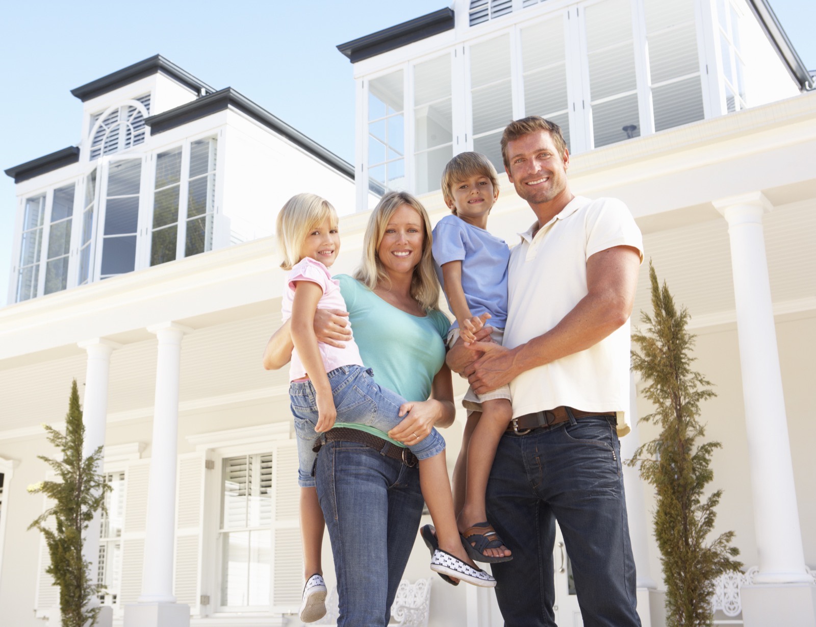 Family in front of their home