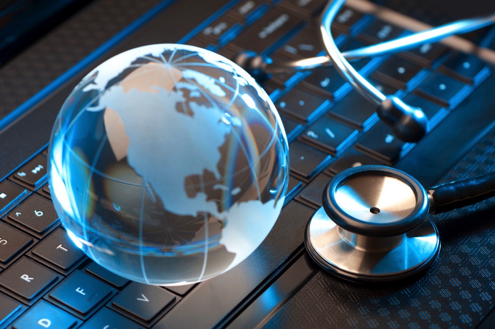 Glass globe and stethoscope representing international medicine