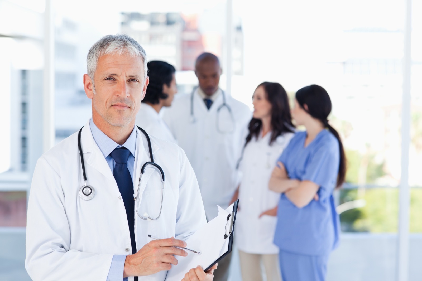 Senior physician with his medical team